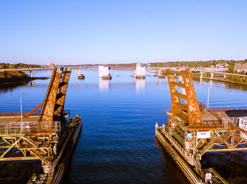 High angle view of bridge over river against clear blue sky