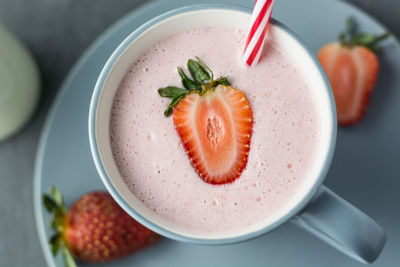 Fresh strawberry shake smoothie overhead shot