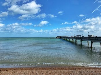 Pier over sea against sky