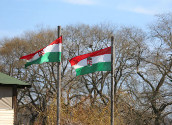 Low angle view of flag against sky