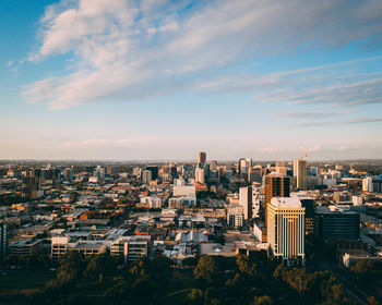 High angle view of buildings in city against sky