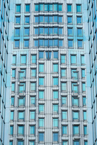 Low angle view of modern glass building in city