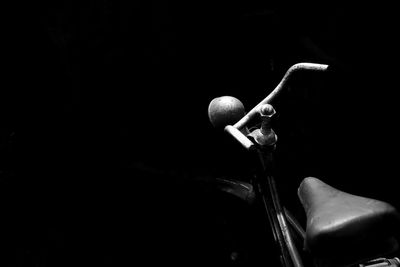 Close-up of lighting equipment against black background