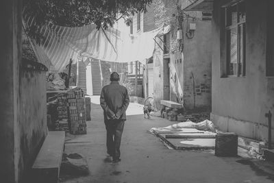 Rear view of man working at construction site