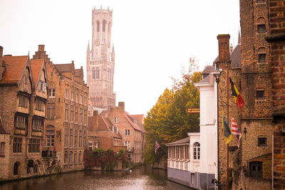 Canal amidst buildings in town