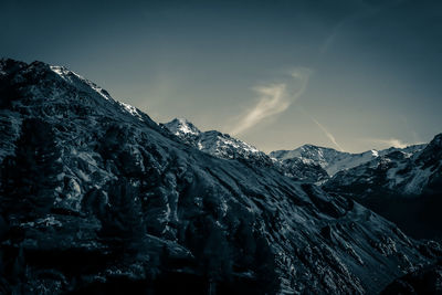 Scenic view of mountains against sky at night