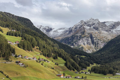 Scenic view of landscape and mountains against sky