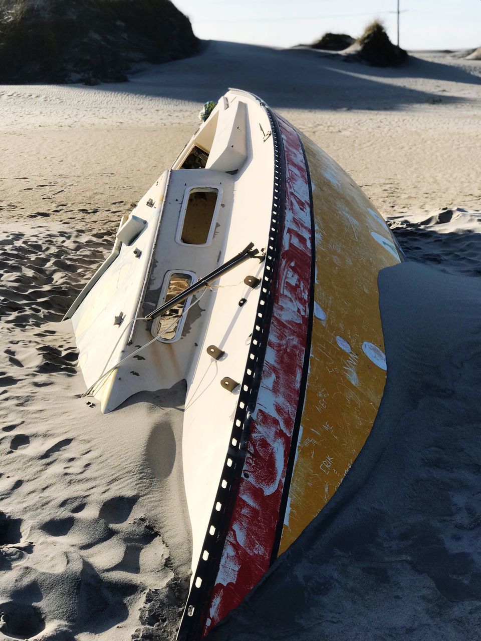 beach, sand, nautical vessel, water, sea, transportation, nature, boat, mode of transport, day, no people, moored, outdoors, sunlight, scenics, beauty in nature, sky