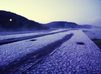 Surface level of road against mountain range