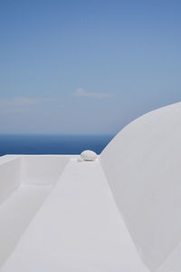 White boat on sea against blue sky