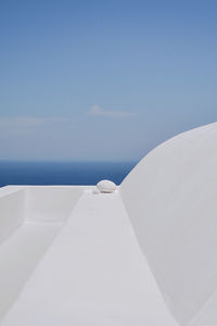 White boat on sea against blue sky