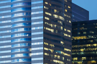 Low angle view of modern buildings at night