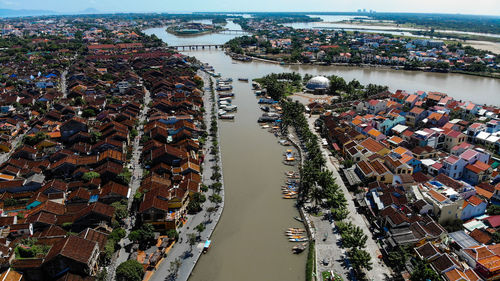 High angle view of buildings and trees in city