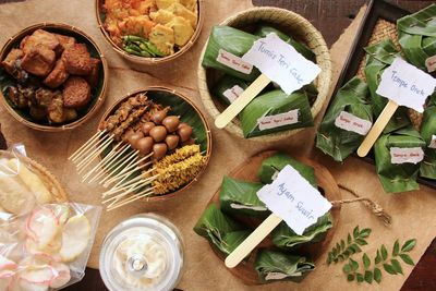 Angkringan nasi kucing. javanese rice stall, serving rice with various toppings in small portions.