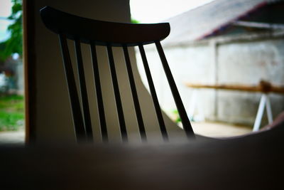 Close-up of empty chair on table