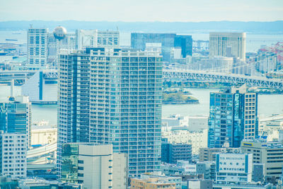 High angle view of buildings in city against sky