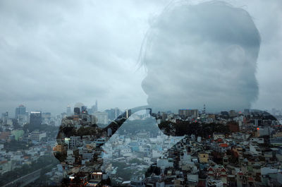 Digital composite image of buildings and city against sky