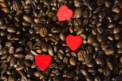 Heart shape decorations on roasted coffee beans