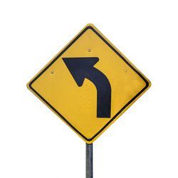 Close-up of arrow sign on road