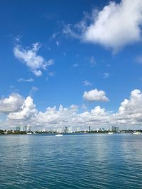 Scenic view of sea and buildings against sky