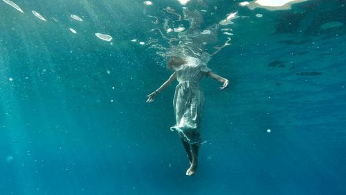 Full length of man jumping in water