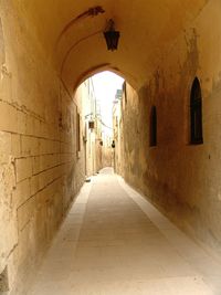 Narrow alley in tunnel