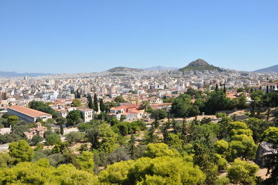 High angle view of cityscape against clear blue sky