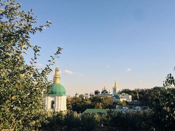 High section of church and trees against sky