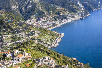 High angle view of townscape by sea