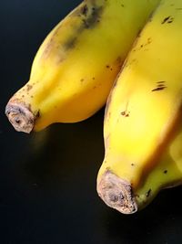 Close-up of yellow fruit against black background