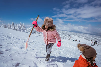 Full length of man skiing on snow