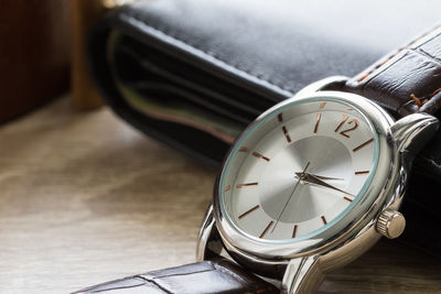 High angle view of clock on table