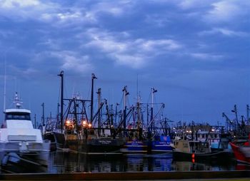 Boats moored at harbor