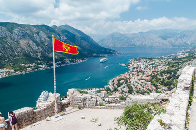 Scenic view of sea and mountains against sky