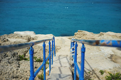 Wooden railing on beach