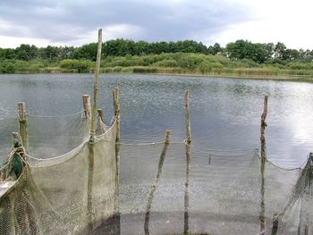 View of lake against cloudy sky