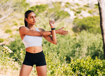 Young woman exercising in park