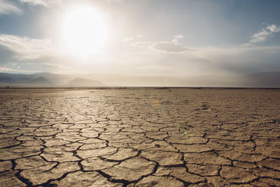 Scenic view of barren landscape against sky