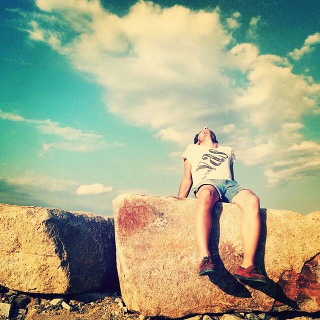 sky, cloud - sky, cloud, sand, tranquility, day, landscape, blue, sunlight, outdoors, art and craft, nature, cloudy, rock - object, tranquil scene, desert, creativity, sitting, art, relaxation