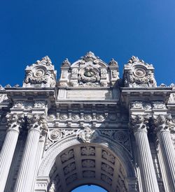 Low angle view of historical building against blue sky