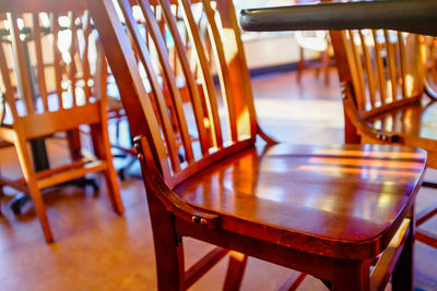 Close-up of empty chairs and table at home
