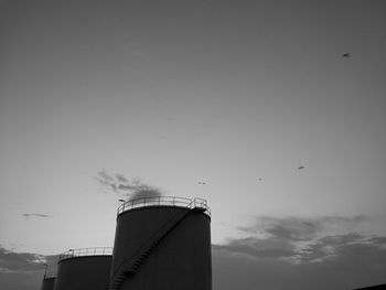 Low angle view of factory against sky