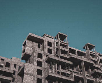 Low angle view of building against clear blue sky