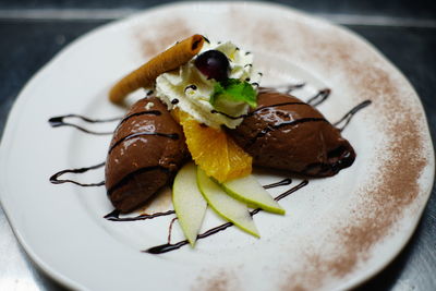 High angle view of fruit in plate on table