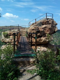 Wooden bridge against sky