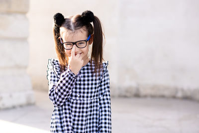 Cute little pupil girl 5-6 year old wear glasses and casual stylish dress. back to school. 