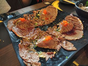 High angle view of meat in plate on table