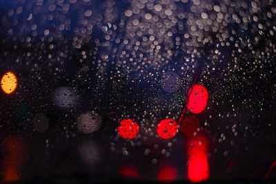 Defocused image of illuminated lights at night