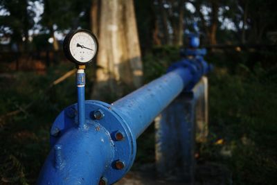 Close-up of machine part on field