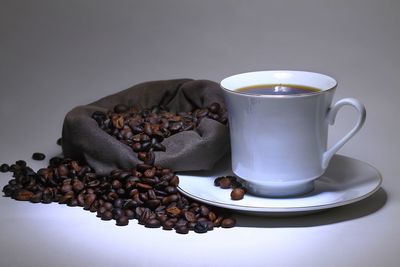 Close-up of coffee beans on table